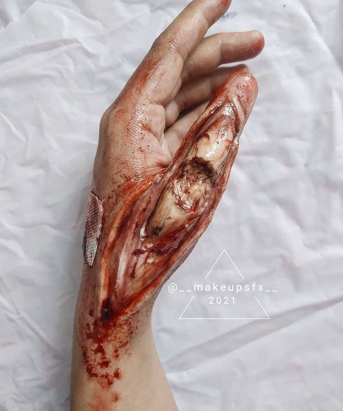 Sepial effect makeup art of an injured hand