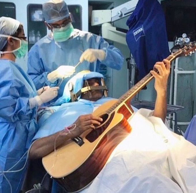 Playing a guitar during brain surgery