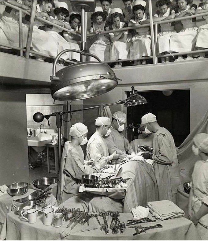 Amazing photograph of medical student observing surgery at  Multnomah Country hospital in 1945