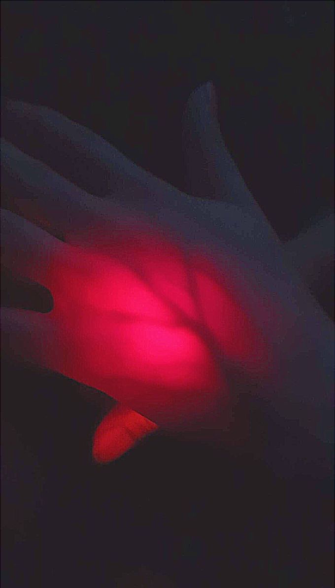 Hand veins under flashlight